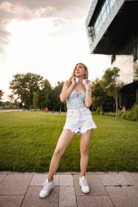 Portrait of beautiful blonde woman with white headphones in outdoor Portrait of beautiful blonde woman with white headphones in outdoor., model released, , 96723124.jpg RECORD DATE NOT STATED