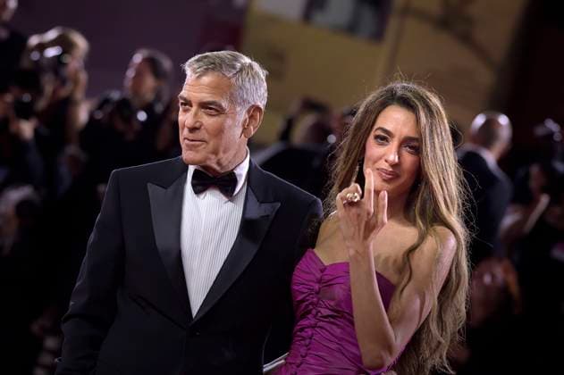 Amal Clooney and George Clooney attend the Jay Kelly red carpet during the 82nd Venice International Film Festival on Thursday, August 28, 2025 in Venice, Italy.  VEN20250828214 RoccoxSpaziani