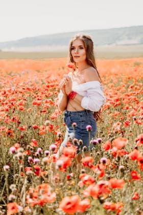 Woman poppies field. Side view of a happy woman with long hair in a poppy field and enjoying the beauty of nature in a warm summer day. Woman poppies field. Side view of a happy woman with long hair in a poppy field and enjoying the beauty of nature in a warm summer day, model released, , 63322148.jpg RECORD DATE NOT STATED
