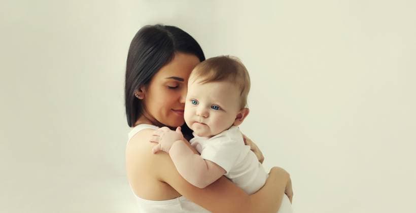 Happy young mother holding cute baby together in white room at home Happy young mother holding her cute baby sitting together in white room at home, model released, , 63259956.jpg RECORD DATE NOT STATED