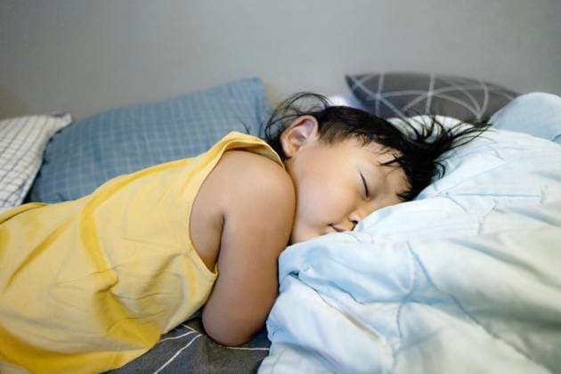 Child Lying On The Bed Sick ill little kid suffer from flu fever asleep in bed. Child Lying On The Bed., model released, , 64255244.jpg RECORD DATE NOT STATED