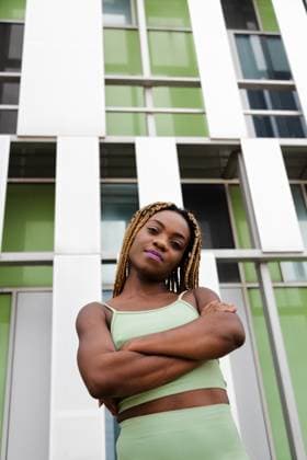 Vertical portrait of African American woman with braided hair looking at camera. Copy space. Vertical portrait of African American woman with braided hair looking at camera. Copy space. Lifestyle concept., model released, , 63841896.jpg RECORD DATE NOT STATED