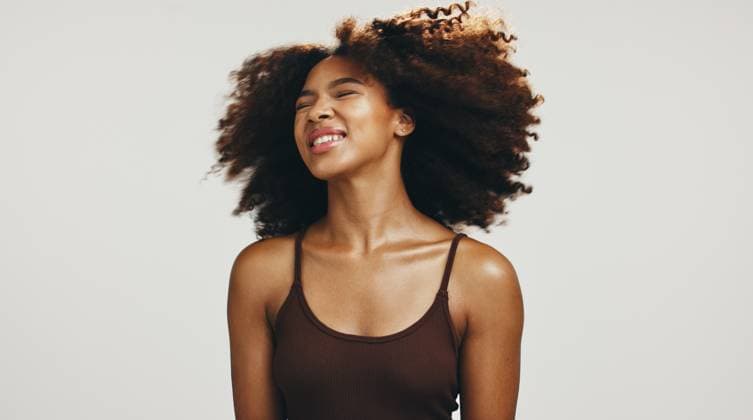 Smile, hair and shake with woman in studio for volume, natural texture and beauty. Happiness, self care and confident with African person on white background for growth, shampoo and salon treatment Smile, hair and shake with woman in studio for volume, natural texture and beauty. Happiness, self care and confident with African person on white background for growth, shampoo and salon treatment., model released, , 95218036.jpg RECORD DATE NOT STATED