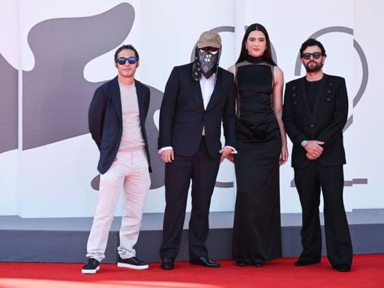 Venice, 82nd Venice International Film Festival 2025 - evening 7 - red carpet of the film L Etranger (The Stranger) In the photo: Eric Kohn, Stillz, Arca and Esteban Zuluaga  Copyright: xSimonexComix xipa-agency.netx xPoolxPhotoxEventsx06x IPA_Agency_IPA63959556