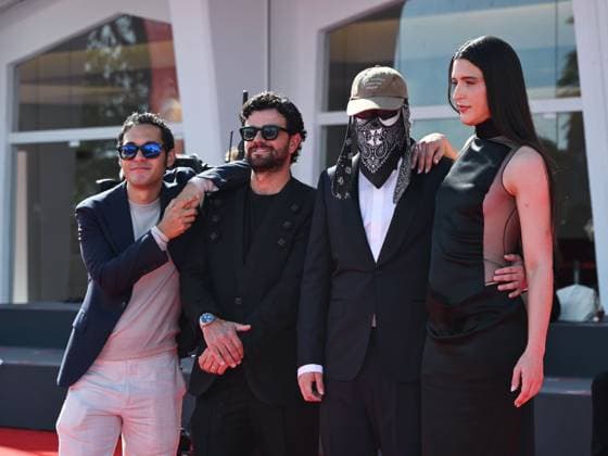 Venice, 82nd Venice International Film Festival 2025 - evening 7 - red carpet of the film L Etranger (The Stranger) In the photo: Eric Kohn, Stillz, Arca and Esteban Zuluaga  Copyright: xSimonexComix xipa-agency.netx xPoolxPhotoxEventsx06x IPA_Agency_IPA63959584