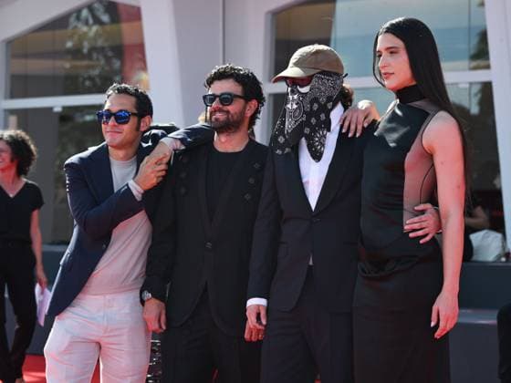 Venice, 82nd Venice International Film Festival 2025 - evening 7 - red carpet of the film L Etranger (The Stranger) In the photo: Eric Kohn, Stillz, Arca and Esteban Zuluaga  Copyright: xSimonexComix xipa-agency.netx xPoolxPhotoxEventsx06x IPA_Agency_IPA63959593