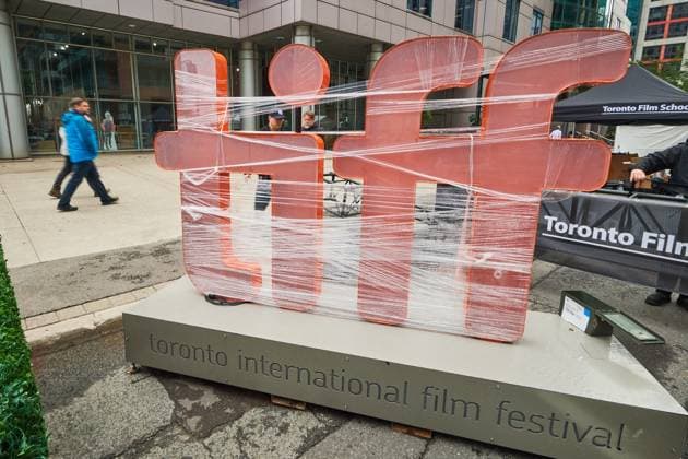 September 4, 2025, Toronto, On, Canada: Pedestrians walk by a covered TIFF sign as preparations for the Toronto International Film Festival continue in Toronto on Thursday, Sept. 4, 2025. Toronto Canada  - ZUMAc35_ 20250904_zaf_c35_052 Copyright: xSammyxKoganx