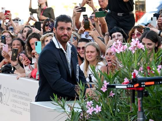 Venice, Italy: Venice, 82nd Venice International Film Festival 2025 - Evening 9. Red Carpet for the film Elisa. In the photo, Can Yaman signs autographs. Venice Italy  - ZUMAp169 20250904_zea_p169_1397 Copyright: xManuelexMangiarottix