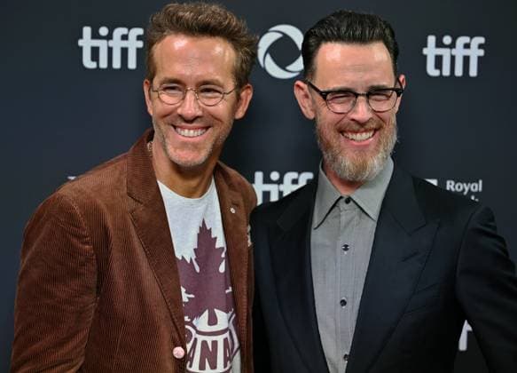 Ryan Reynolds (L) and director Colin Hanks attend the world premiere of John Candy: I like Me on opening night of the Toronto International Film Festival at Roy Thomson Hall in Toronto, Canada on Thursday, September 4, 2025. The festival is celebrating its milestone 50th edition this year and will feature 291 films from around the world.  TOR2025090420 CHRISxCHEW