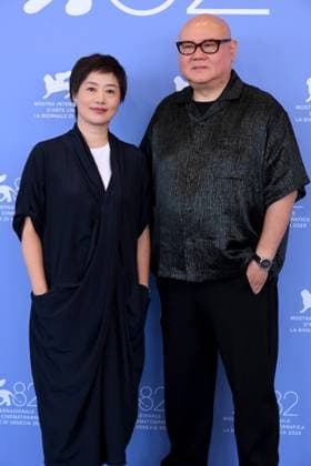 Venice, Italy: Venice,82nd Venice International Film Festival 2025, - Day 10 - Photocall film : Ri Gua Zhong Tian (The Sun Rises On Us All) Pictured : Cai Shangjun and wife Venice Italy  - ZUMAp169 20250905_zea_p169_448 Copyright: xAlbertoxTerenghi PoolxxEvenx