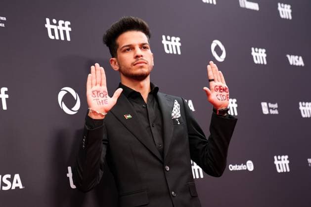 2025 Toronto International Film Festival - Palestine 36 TORONTO, CANADA - SEPTEMBER 5 : A guest, wearing pin of Palestine, poses with the words Stop the Genocide written on his hands during the premiere of ‘Palestine 36’ during the 2025 Toronto International Film Festival at Roy Thomson Hall in Toronto, Ontario, Canada on September 5, 2025. Mert Alper Dervis Anadolu Ontario Canada. Editorial use only. Please get in touch for any other usage.  Copyright: x2025xAnadoluxMertxAlperxDervisx