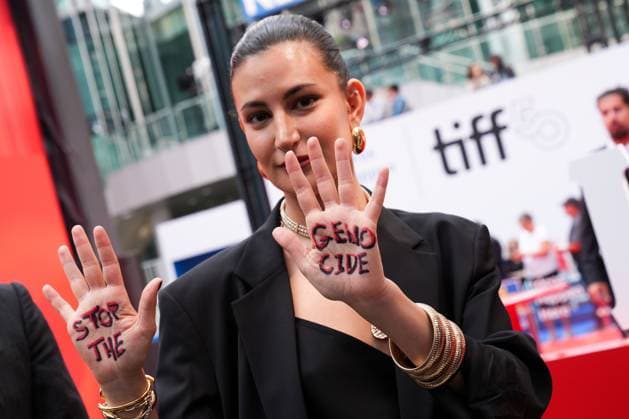 2025 Toronto International Film Festival - Palestine 36 TORONTO, CANADA - SEPTEMBER 5 : A guest poses with the words Stop the Genocide written on her hands during the premiere of ‘Palestine 36’ during the 2025 Toronto International Film Festival at Roy Thomson Hall in Toronto, Ontario, Canada on September 5, 2025. Mert Alper Dervis Anadolu Ontario Canada. Editorial use only. Please get in touch for any other usage.  Copyright: x2025xAnadoluxMertxAlperxDervisx