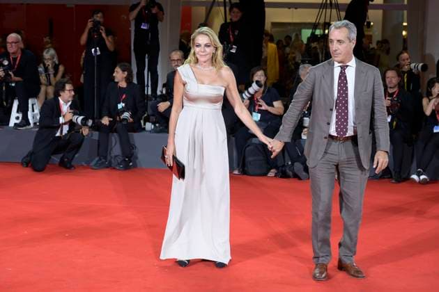 Silent friend red carpet in Venice Lido, Italy - 05 Sep 2025 Claudia Gerini (l) and Riccardo Sangiuliano (r) attend the Silent friend red carpet during the 82nd Venice Film Festival at Palazzo del Cinema. Venice Lido Italy Copyright: xMarioxCartellix xSOPAxImagesx _DSC7584