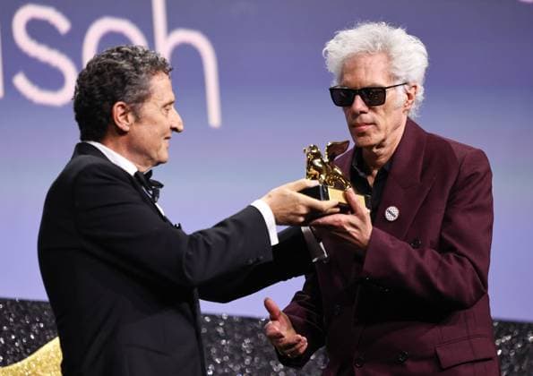 (250907) -- VENICE, Sept. 7, 2025 -- President of the 2025 Venice Biennale Pietrangelo Buttafuoco (L) presents the trophy to American director Jim Jarmusch at the awarding ceremony of the 82nd Venice International Film Festival in Venice, Italy, Sept. 6, 2025. American director Jim Jarmusch s Father Mother Sister Brother won the Golden Lion for Best Film. The 82nd edition of the Venice International Film Festival ran from Aug. 27 to Sept. 6 at the Lido island of the Italian lagoon city, with 21 films in the main competition lineup. ) ITALY-VENICE-FILM FESTIVAL-AWARDING CEREMONY LixJing 
