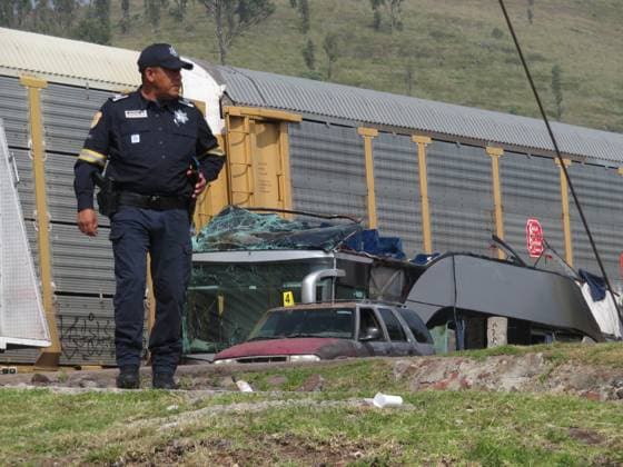 (250908) -- ATLACOMULCO(MEXICO), Sept. 8, 2025 -- A security personel guards at the accident site in the Atlacomulco municipality, the State of Mexico, Mexico, Sept. 8, 2025. At least eight people were killed and 45 others injured early Monday when a double-deck passenger bus was hit by a train in central Mexico, authorities said. (Photo by Jorge Alvarado Xinhua) MEXICO-ATLACOMULCO-CRASH-ACCIDENT LixMengxintonglian 