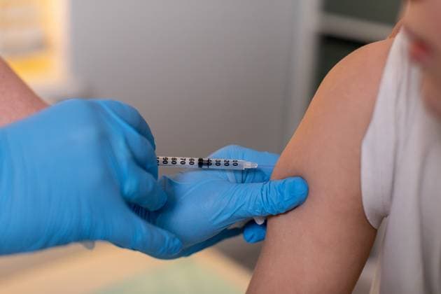 The Vaccination Process for Children Within a Clinical Healthcare Setting or Office Environment A young child is comfortably receiving a vaccination in a safe medical environment by a trained healthcare professional, model released, , property released, , 96320902.jpg RECORD DATE NOT STATED
