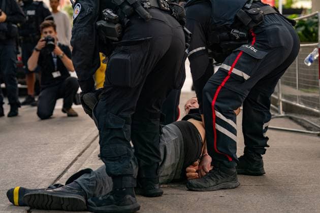 September 10, 2025, Toronto, On, Canada: Toronto Police arrest a man as protesters and counter-protesters gather outside of Roy Thomson Hall during the screening of the documentary The Road Between Us: The Ultimate Rescue at the Toronto International Film Festival in Toronto on Wednesday, Sept. 10, 2025. Toronto Canada  - ZUMAc35_ 20250910_zaf_c35_068 Copyright: xArlynxMcadoreyx
