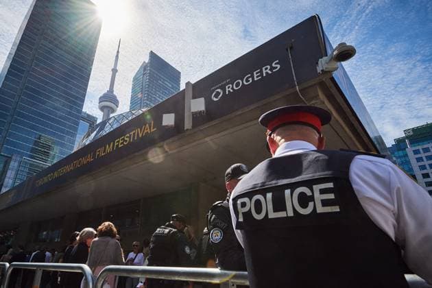September 10, 2025, Toronto, On, Canada: Police stand by the screening line-up as protesters and counter-protesters gather outside of Roy Thomson Hall during the screening of the documentary The Road Between Us: The Ultimate Rescue at the Toronto International Film Festival in Toronto on Wednesday, Sept. 10, 2025. Toronto Canada  - ZUMAc35_ 20250910_zaf_c35_083 Copyright: xSammyxKoganx