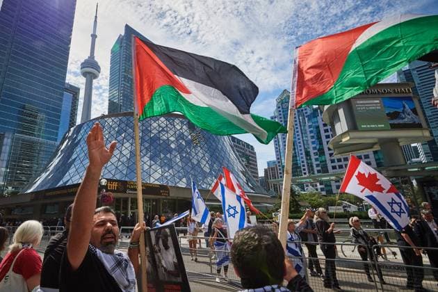 September 10, 2025, Toronto, On, Canada: Protesters and counter-protesters gather outside of Roy Thomson Hall during the screening of the documentary The Road Between Us: The Ultimate Rescue at the Toronto International Film Festival in Toronto on Wednesday, Sept. 10, 2025. Toronto Canada  - ZUMAc35_ 20250910_zaf_c35_061 Copyright: xSammyxKoganx
