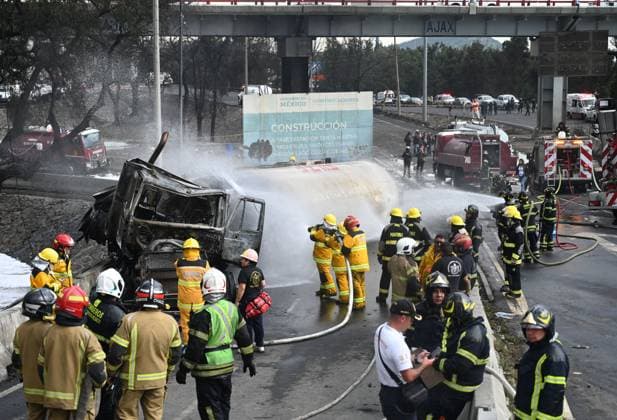 (250910) -- MEXICO CITY, Sept. 10, 2025 -- Firefighters work at the gas tanker truck explosion accident site in Mexico City, Mexico, Sept. 10, 2025. Fifty-seven people were injured after a gas tanker truck exploded on Wednesday in Mexico City, with 19 of them in serious condition, local authorities said. (Str Xinhua) MEXICO-MEXICO CITY-GAS TANKER TRUCK-EXPLOSION LixMengxintonglian 