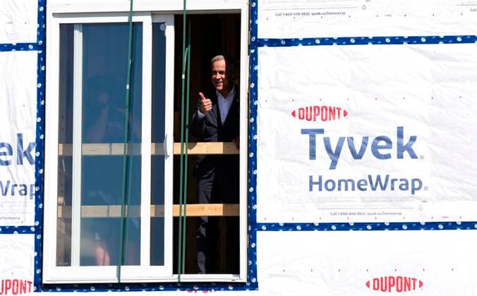 September 14, 2025, Ottawa, On, CAN: Prime Minister Mark Carney gives a thumbs up from a window during a tour of a new modular home being built by Caivan Homes, as he announces the new federal agency Build Canada Homes, in Ottawa on Sunday, Sept. 14, 2025. Ottawa CAN  - ZUMAc35_ 20250914_zaf_c35_064 Copyright: xJustinxTangx