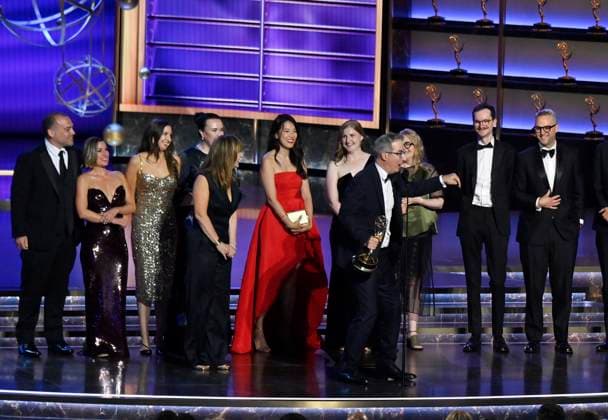 John Oliver (C) accepts the Outstanding Scripted Variety Series award for Last Week Tonight with John Oliver onstage at the 77th annual Primetime Emmy Awards at the Peacock Theater in Los Angeles on Sunday, September 14, 2025.  LAP2025091480488 JIMxRUYMEN