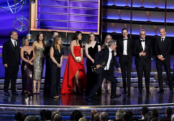 John Oliver (C) accepts the Outstanding Scripted Variety Series award for Last Week Tonight with John Oliver onstage at the 77th annual Primetime Emmy Awards at the Peacock Theater in Los Angeles on Sunday, September 14, 2025.  LAP2025091480489 JIMxRUYMEN