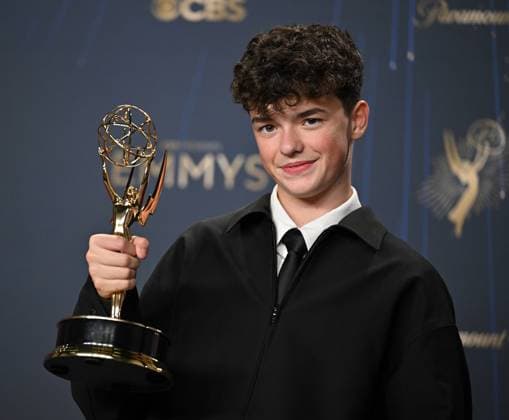 Owen Cooper holds the Emmy for Outstanding Supporting Actor in a Limited or Anthology Series or Movie for Adolescence, backstage during the 77th annual Primetime Emmy Awards at the Peacock Theater in Los Angeles on Sunday, September 14, 2025.  LAP20250914185 CHISxCHEW
