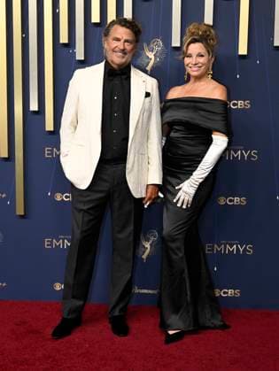 Ted McGinley and his wife Gigi Rice arrive the 77th annual Primetime Emmy Awards at the Peacock Theater in Los Angeles on Sunday, September 14, 2025.  LAP20250914797 JohnxMcCoy