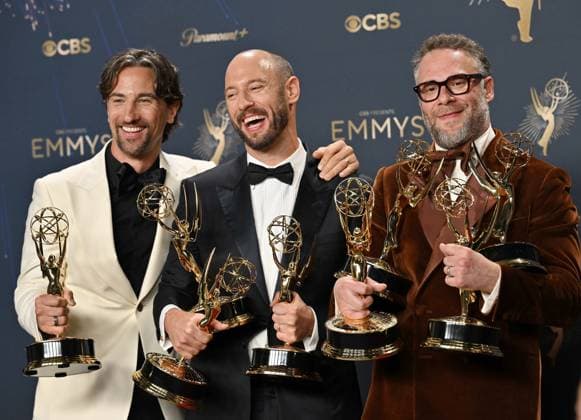 (L-R) James Weaver, Evan Goldberg, and Seth Rogen hold the Emmy for Outstanding Comedy Series, Outstanding Writing For a Comedy Series, Lead Actor in a Comedy Series and more for The Studio, backstage during the 77th annual Primetime Emmy Awards at the Peacock Theater in Los Angeles on Sunday, September 14, 2025.  LAP20250914300 CHISxCHEW