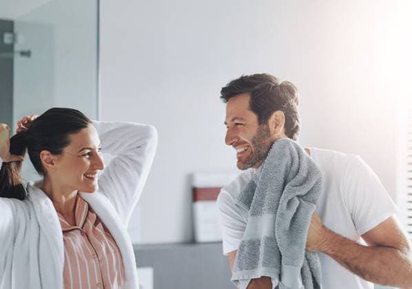 Couple, beauty and happy in bathroom for morning routine with skincare, grooming and haircare in home. People, laughing or getting ready with hygiene preparation, start of day or wellness for wake up Couple, beauty and happy in bathroom for morning routine with skincare, grooming and haircare in home. People, laughing or getting ready with hygiene preparation, start of day or wellness for wake up., model released, , 60951532.jpg RECORD DATE NOT STATED