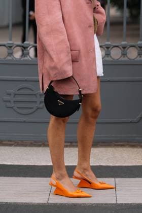 RECORD DATE NOT STATED Milan, Italy - September, 21, 2023: woman wears orange brushed leather pumps, high heels from Prada and shoulder bag Milan, Italy - September, 21, 2023: woman wears orange brushed leather pumps, high heels from Prada and shoulder bag, street style accessories, 96472744.jpg