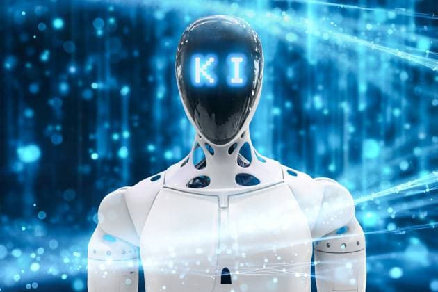 Germany - September 16, 2025: PHOTOMONTAGE, A futuristic robot with the letters AI? on its face stands in the middle of a glowing digital world a symbol of artificial intelligence, innovation, and technological change. *** FOTOMONTAGE, Ein futuristischer Roboter mit dem Schriftzug KI im Gesicht steht inmitten einer leuchtenden digitalen Welt Sinnbild für künstliche Intelligenz, Innovation und den technologischen Wandel.
