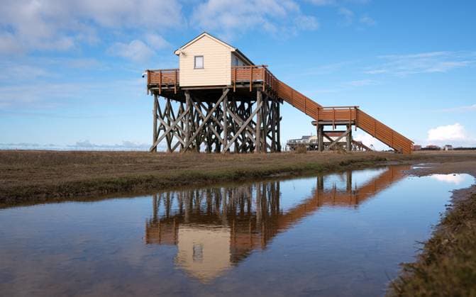 RECORD DATE NOT STATED Sankt Peter Ording, North Frisia, Germany SANKT PETER ORDING, GERMANY - MARCH 8, 2023: Panoramic image of beach houses of Sankt Peter Ording close to the North Sea on March 8, 2023 in North Frisia, Germany, 95869404.jpg
