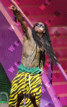 **File Photos** * LIL WAYNE IN CRITICAL CONDITION AFTER SUFFERING ANOTHER SEIZURE - REPORT Rapper LIL WAYNE is reportedly fighting for life at Cedars Sinai Medical Center in Los Angeles after suffering a second series of seizures in a week. The hitmaker has been placed in an induced coma, according to TMZ.com, and he has been listed in critical condition. Lil Wayne, real name Dwayne Michael Carter, Jr., was initially hospitalised in Los Angeles on Tuesday night (12Mar13) after suffering multiple seizures. He was released on Wednesday (13Mar13) but taken back to the medical centre hours later after a bodyguard found him lying unconscious in his room. The website reports the rap star is currently in the intensive care unit at Cedars Si WENN 4006802.jpg