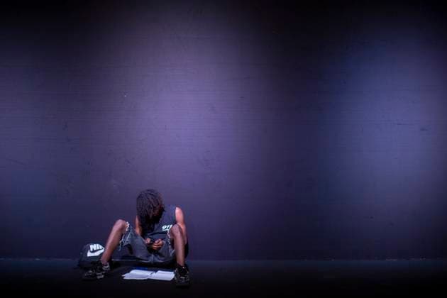 September 20, 2025, Madrid, Madrid, Spain: A model looks at his cell phone while sitting on the floor for during the Fely Campo Spring Summer 2026 collection runway show during the 40th Mercedes-Benz Fashion Week in Madrid. Madrid Spain - ZUMAs296 20250920_znp_s296_010 Copyright: xLuisxSotox