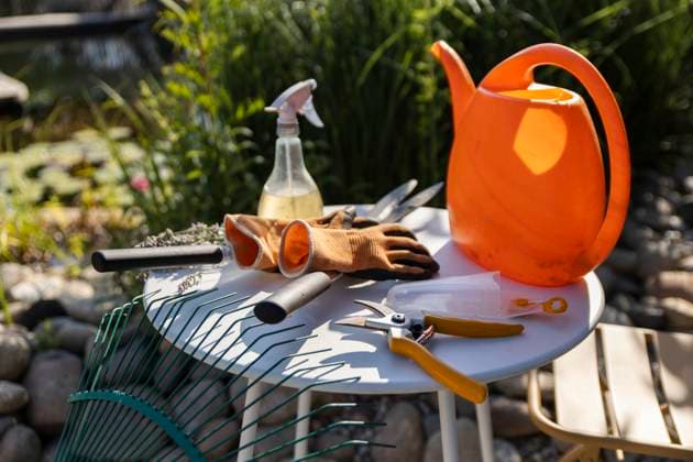 Gardening tools and eco-friendly equipment on outdoor table in sunshine property released, PCLF02581