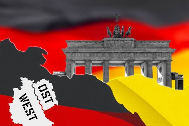 FOTOMONTAGE, Symbolbild zum Ost-West-Gefälle in Deutschland: Brandenburger Tor mit Karte von Ost- und Westdeutschland vor schwarz-rot-goldenem Hintergrund.