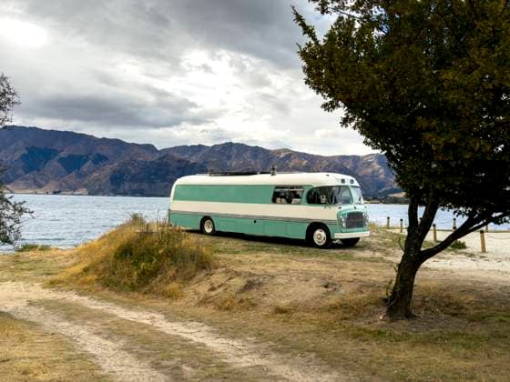 MR_ID31268_22828_AlvaroEsteller.jpg, MR_ID31268_22829_XimenaLozano.jpg A vintage camper van is parked by Lake Wanaka near Roys Peak in New Zealand during autumn. The scenic mountain backdrop and lakeside setting evoke freedom and adventure travel Model Released JuanAizpuru_ID31268_1061759_018 Copyright: xJuanxAizpurux