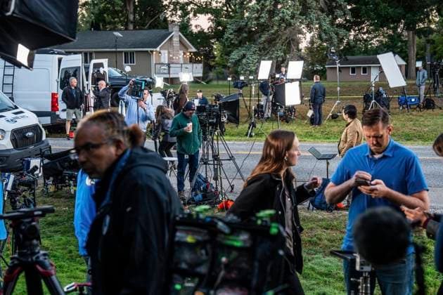 September 29, 2025, Grand Blanc, Michigan, USA: Network television stations post up on McCandlish Road in Grand Blanc Township on Monday, September 29, 2025, near the site where a mass shooting involving an ex-U.S. Marine occurred at The Church of Jesus Christ of Latter-day Saints in Grand Blanc Township. Grand Blanc USA - ZUMAf31_ 20250929_zaf_f31_002 Copyright: xRyanxGarzax