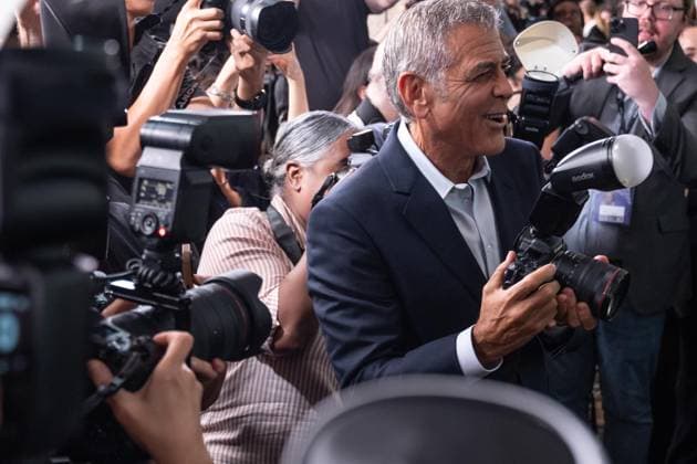 September 29, 2025, Bronx, New York, USA: George Clooney takes camera from photographer to take photo of cast at screening of Jay Kelly at 63rd annual New York Film Festival at Alice Tully Hall in New York, NY on September 29, 2025. Bronx USA - ZUMAr339 20250929_znp_r339_145 Copyright: xLevxRadinx