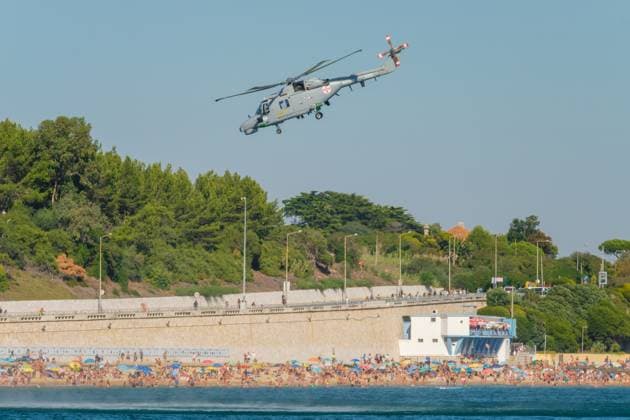 Westland Lynx military helicopter of Portuguese Navy demo flight at Oeiras Air Show Oeiras, Portugal - September 30, 2023: Westland Lynx military helicopter of Portuguese Navy demo flight at Oeiras Air Show above crowded beach, 94831620.jpg RECORD DATE NOT STATED