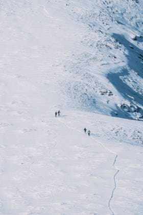 Group of backcountry skiers going up hill, against mountain peak Navacerrada, Community of Madrid, Spain R_JALO210111-603335-01 EDITORIAL USE ONLY