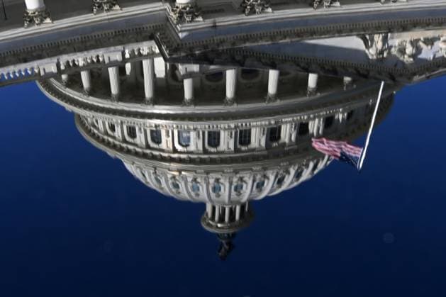 News Bilder des Tages (251001) -- WASHINGTON, Oct. 1, 2025 -- The U.S. Capitol building is seen reflected on the hood of a vehicle in Washington, D.C., the United States, on Oct. 1, 2025. The U.S. Senate on Wednesday failed to approve a short-term spending bill, as the federal government entered its first shutdown in nearly seven years. ) U.S.-WASHINGTON, D.C.-SENATE-BILL-FAIL LixRui 