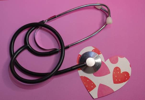 Top view stethoscope with an image of heart printed on pink background. Pediatrics and infant cardiology.Concept of child health care .Horizontal photo with space for text on pink background., 60750860.jpg RECORD DATE NOT STATED