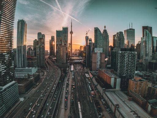 Aerial view of Toronto skyline at sunset with the CN Tower and busy highway. 34980008 RECORD DATE NOT STATED