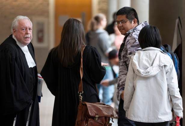 October 6, 2025, Longueuil, Pq, CANADA: Defence lawyer Gary Martin, left, meets his client Yuesheng Wang and his partner as they arrive for his espionage trial at the Longueuil courthouse in Longueuil, Que., on Monday, Oct. 6, 2025. Longueuil CANADA  - ZUMAc35_ 20251006_zaf_c35_005 Copyright: xChristinnexMuschix