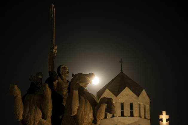 ARMENIA, YEREVAN - OCTOBER 6, 2025: A full moon shines over the Cathedral of St Gregory the Illuminator, with a monument to General Andranik (1865-1927) in the front. Alexander Patrin TASS  84650734