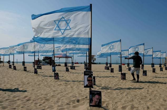 October 7, 2025, Rio De Janeiro, Rio De Janeiro, Brazil: Rio de Paz, a Brazilian human rights NGO known for its symbolic public demonstrations installed 22 Israeli flags and photos of 48 hostages on Copacabana Beach in a demonstration against terrorism and in solidarity with the victims of the Hamas attack on October 7, 2023, marking two years since the attacks on Israel. The act denounced terrorism and called for the release of hostages still held in Gaza. Rio De Janeiro Brazil - ZUMAo Pr 20251007_znp_k251_006 Copyright: xBobxKarpx