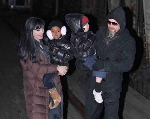 Angelina Jolie and Brad Pitt carry their children, Shiloh Jolie-Pitt and Zahara Jolie Pitt, as they leave the set of Salt in Manhattan, New York City, United States WENN 5410716.jpg